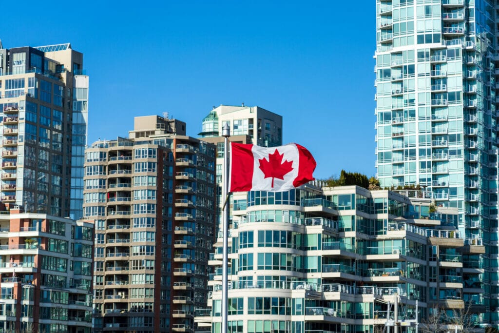 Top 10 Cities in Canada with the Best Housing Options for Travel Nurses 1 national flag canada with downtown vancouver city condominium apartment background concept